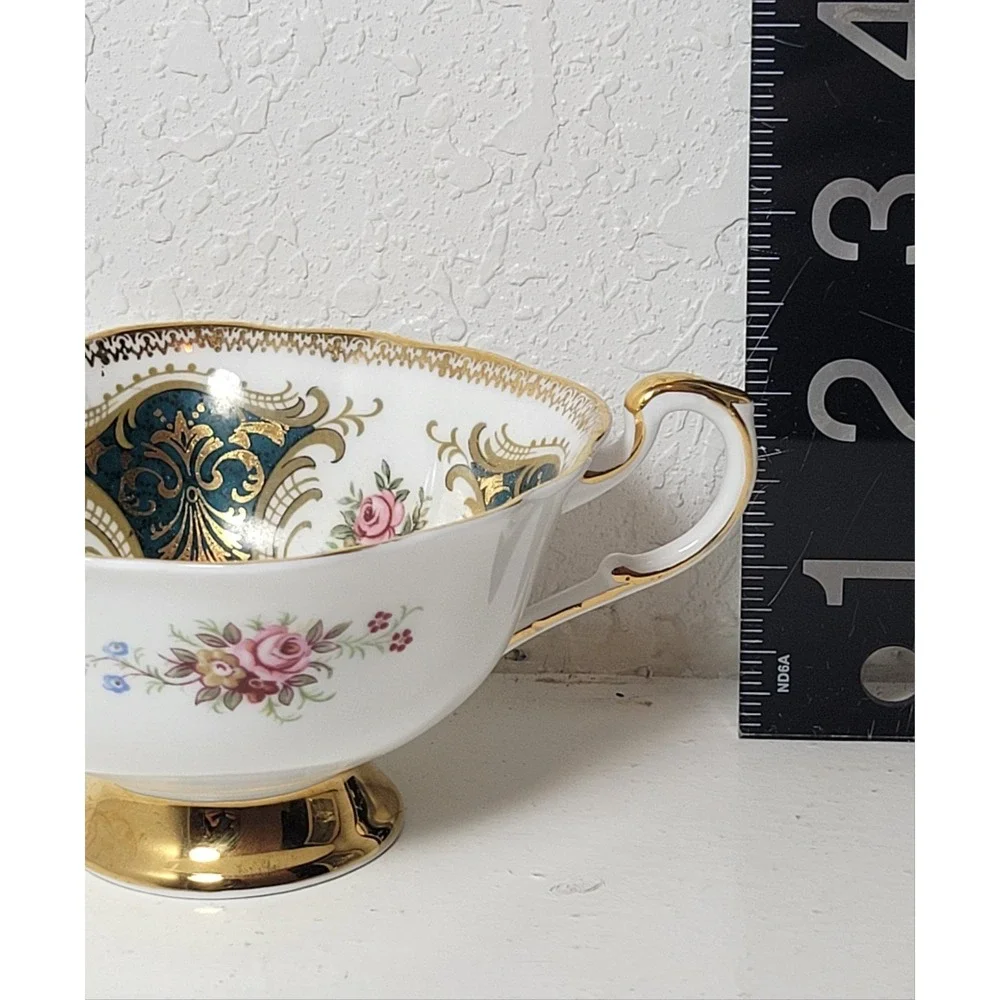 Paragon teacup - dark green panels on white background with floral‎ decor...Read